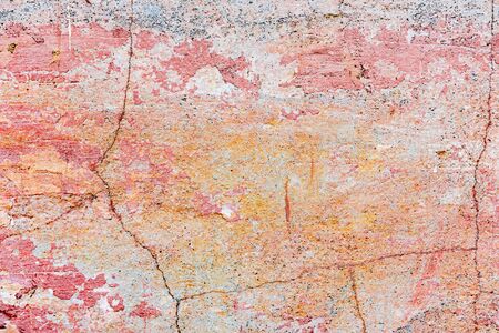 Texture of a concrete wall with cracks and scratches which can be used as a backgroundの写真素材