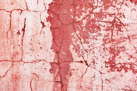 Texture of a concrete wall with cracks and scratches which can be used as a backgroundの写真素材
