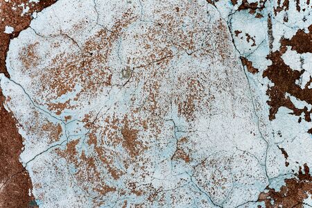 Texture of a concrete wall with cracks and scratches which can be used as a background