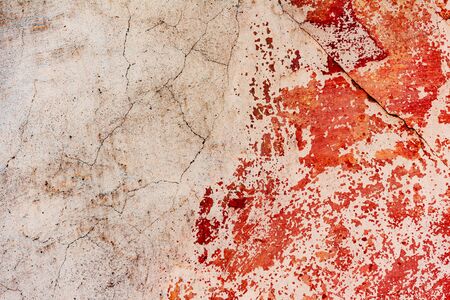 Texture of a concrete wall with cracks and scratches which can be used as a background