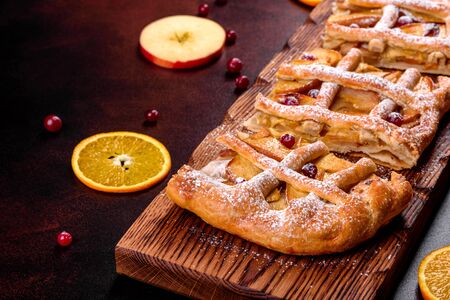 Delicious fresh pie baked with apple, pears and berries. Fresh pastries for delicious breakfastの写真素材