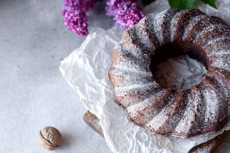 Round chocolate coffee cupcake with raisins and poppy. Traditional cupcake with a hole. の写真素材