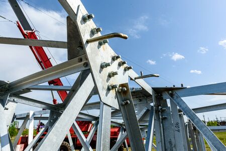 High voltage electric pillar from under. A high-voltage electricity tower. A High-voltage power transmission towerの写真素材