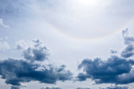 Dramatic summer sky with clouds at sunset. It can be used as a backgroundの写真素材