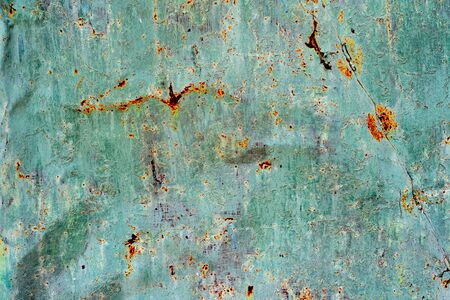 Texture of a metal wall with cracks and scratches which can be used as a backgroundの写真素材