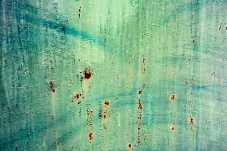 Texture of a metal wall with cracks and scratches which can be used as a background