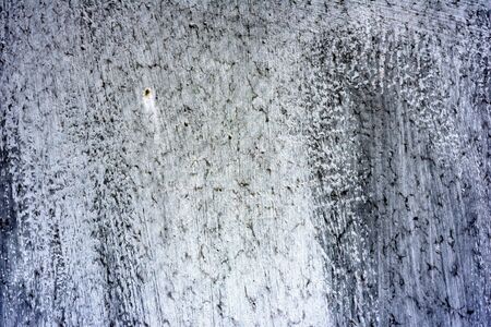 Texture of a metal wall with cracks and scratches which can be used as a background