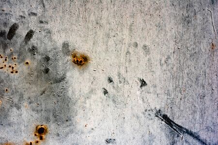 Texture of a metal wall with cracks and scratches which can be used as a background