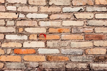 Texture, brick, wall, it can be used as a background. Brick texture with scratches and cracks