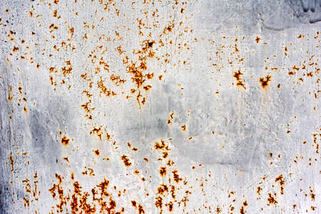 Texture of a metal wall with cracks and scratches which can be used as a background