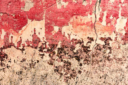 Old grunge crack pink concrete wall texture backgroundの写真素材