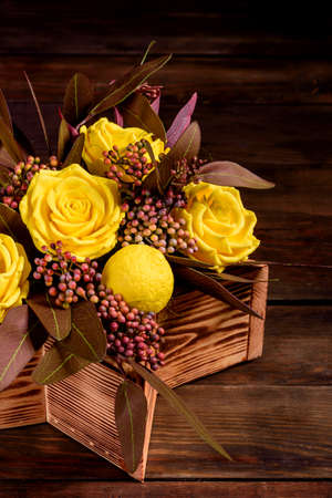 Bouquet of beautiful bright yellow rose flowers in a gift box. Gift bouquet of soap flowersの写真素材