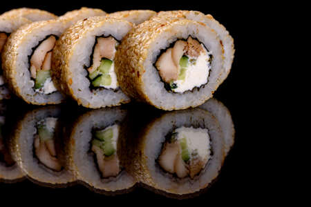 Fresh delicious beautiful sushi rolls on a dark background. Elements of Japanese cuisineの写真素材
