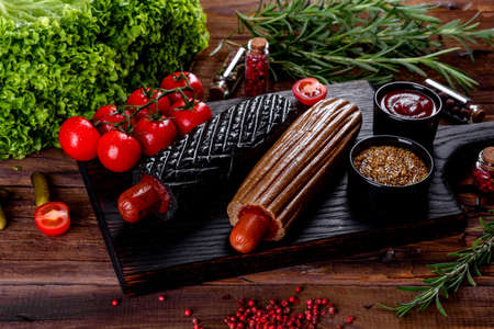 Delicious fresh hot hotdogs with various kinds of buns and sausages. Fast food, non-useful food
