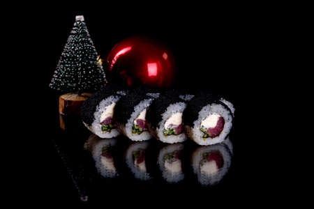 Fresh delicious  sushi rolls on  darkの写真素材