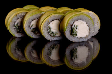 Fresh delicious beautiful sushi rolls on a dark background. Elements of Japanese cuisineの写真素材