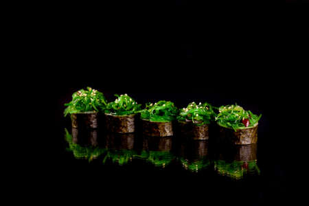 Fresh delicious  sushi rolls on darkの写真素材