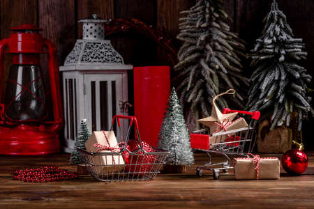 Shopping cart with Christmas gifts and presents. Christmas shopping and sale concept.の写真素材