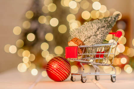 Shopping cart with Christmas gifts and presents. Christmas shopping and sale conceptの写真素材
