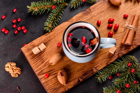 Hot mulled wine for winter and Christmas with various spices. Preparing for the Christmas holidays
