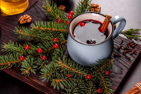 Hot mulled wine for winter and Christmas with various spices. Preparing for the Christmas holidays