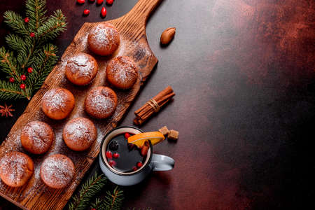 Beautiful delicious fresh cocoa muffins on the Christmas table. Preparing for the holidayの写真素材