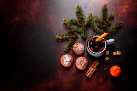 Beautiful delicious fresh cocoa muffins on the Christmas table. Preparing for the holiday