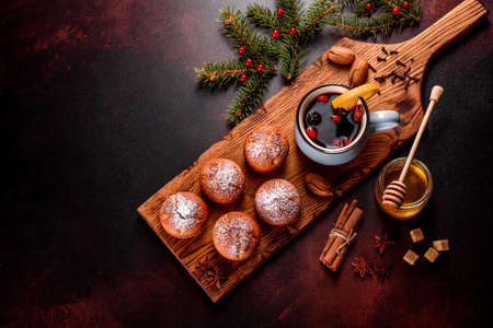 Beautiful delicious fresh cocoa muffins on the Christmas table. Preparing for the holidayの写真素材