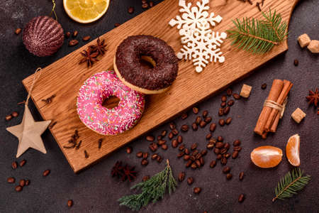 A cup of strong coffee on the Christmas table with spruce twigs and toys. Preparing for the holidayの写真素材