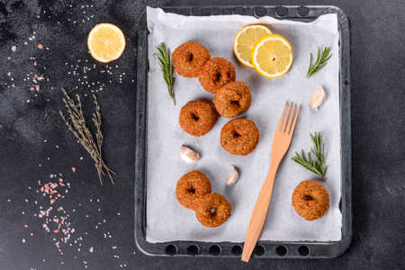 Beautiful delicious fresh chickpea falafel with sauces on a concrete background. Elements of...