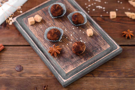 Tasty fresh handmade sweet candy with cheese filling and sprinkling on a concrete table