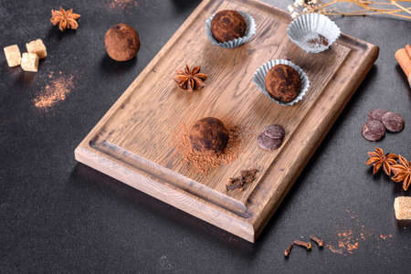 Tasty fresh handmade sweet candy with cheese filling and sprinkling on a concrete tableの写真素材