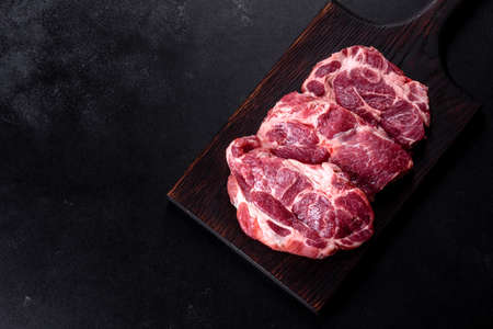 Fresh raw beef meat to make delicious juicy steak with spices and herbs. Preparation for grilled...