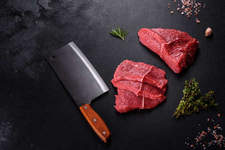 Fresh raw beef meat to make delicious juicy steak with spices and herbs. Preparation for grilled...