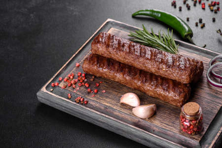 Fresh tasty kebab grilled with spices and herbs. Grilled meat dishの写真素材