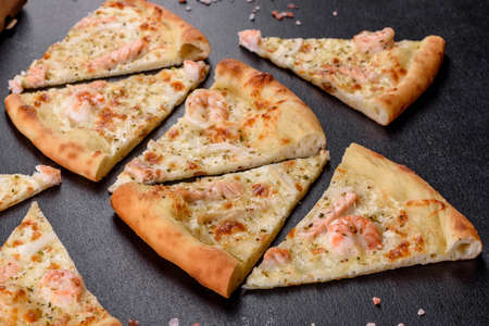 Delicious fresh seafood oven pizza: red fish and shrimp. Healthy food. Italian cuisineの写真素材