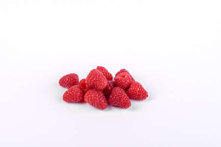 Ripe red raspberries isolated on white backgroundの写真素材