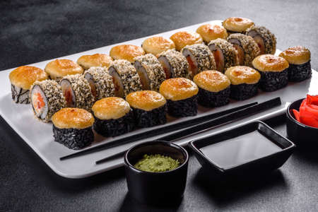 Japanese sushi food. Maki ands rolls with tuna, salmon, shrimp, crab and avocadoの写真素材