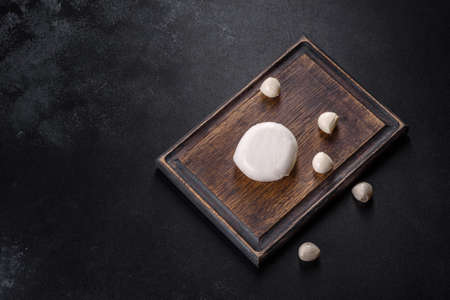 Tasty fresh mozzarella cheese for making caprese salad. Mediterranean foodの写真素材