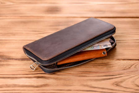 Beautiful leather brown purse made of leather to store paper money and credit cards