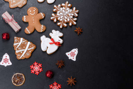 Christmas festive ginger gingerbread made at home on a dark table. Preparations for the New Year and Christmasの写真素材
