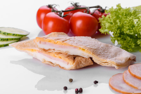 Delicious fresh sandwich grill with pita, cheese and meat. Unhealthy food, fast foodの写真素材