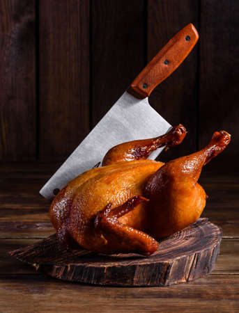 Tasty fresh baked turkey with spices and herbs for a family holiday table.の写真素材