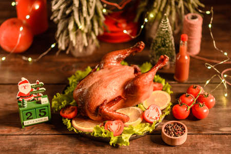 Tasty fresh baked turkey with spices and herbs for a family holiday table. Family Christmas...
