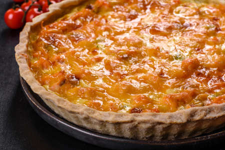 Delicious fresh quiche with broccoli, salmon and cheese. Vegetarian pie with fish and vegetables