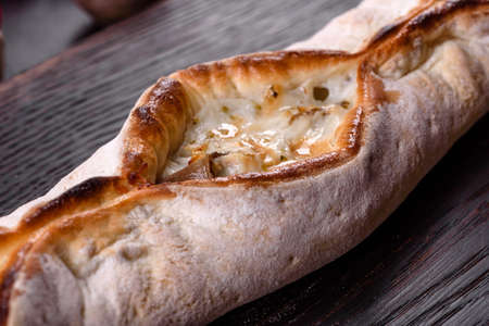 Delicious fresh street pizza with chicken, mushrooms and cheese. Street food, fast food