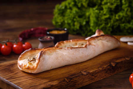 Delicious fresh street pizza with chicken, mushrooms and cheese. Street food, fast food
