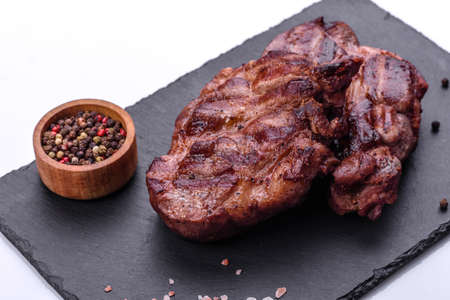 Closeup view of delicious grilled beef medallions served on tableの写真素材