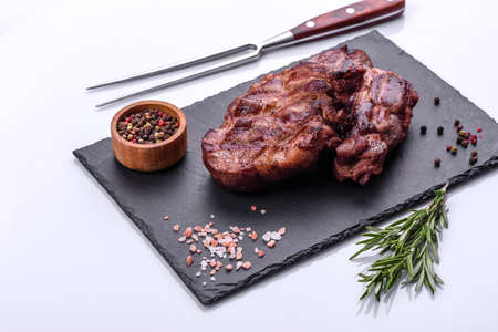 Closeup view of delicious grilled beef medallions served on tableの写真素材