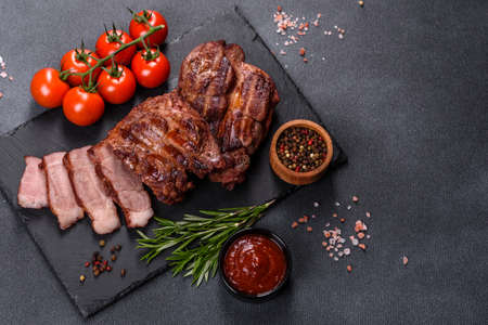 Closeup view of delicious grilled beef medallions served on tableの写真素材